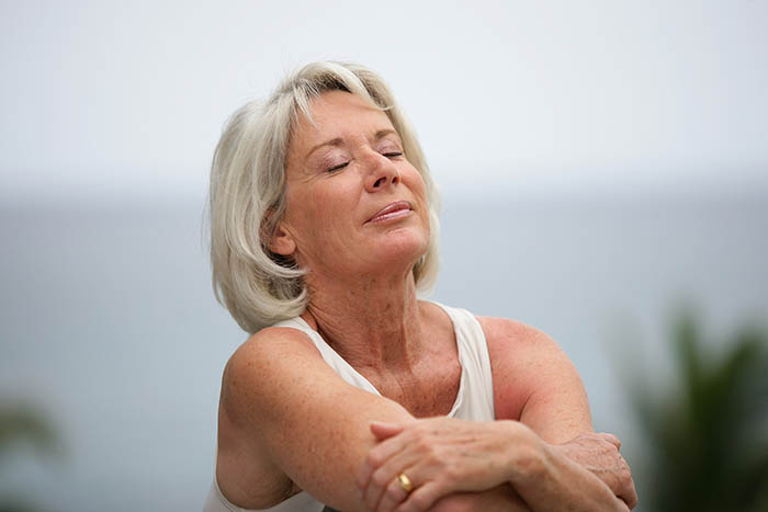 senior relaxing outdoors A mature woman outside